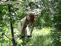 3 movies - Hiddencam video report from the woods where a juicy-boobed redhead babe undresses